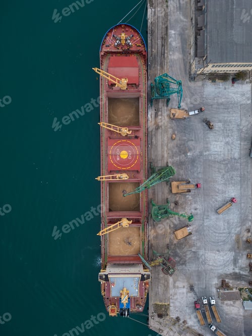 Preview: Aerial view of big cargo ship bulk carrier is loaded with grain of wheat in port