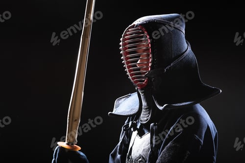 Preview: Kendo fighter in helmet holding bamboo sword on black