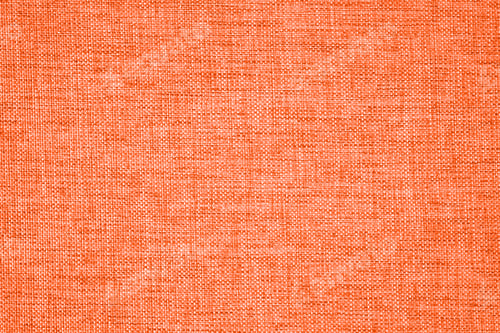 Preview: Close-up view of orange textured fabric with woven patterns and soft appearance