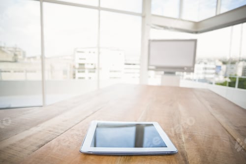 Preview: Tablet in front of meeting room in the office