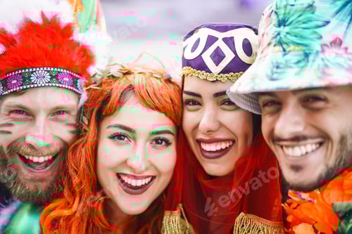 Preview: Happy friends celebrating carnival party outdoor