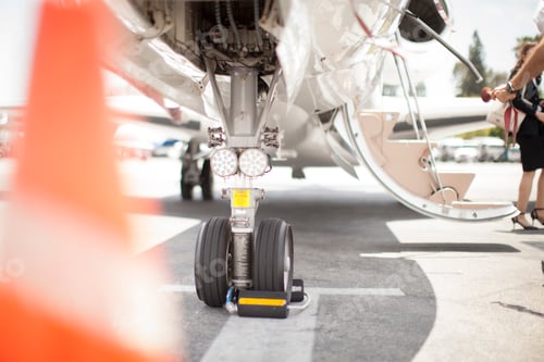 Preview: Female businesswoman leaving private jet at airport