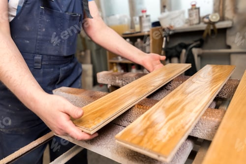 Manual production of parquet boards wood flooring factory.