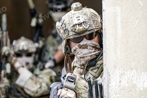 Preview: Soldier in full US MARSOC armed with assault rifle run through the abandoned building. Military