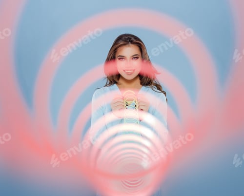 Preview: Happy girl smiling for camera and playing with spring