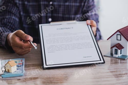 Preview: Customer signing contract about home loan agreement, Purchase agreement for a house with model home