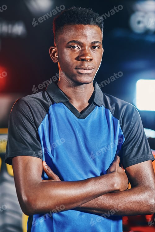 Preview: Vertical shot of young confident african guy, male cyber sport gamer keeping arms crossed and