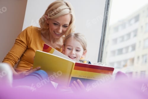 Preview: Mother reading picture book to daughter
