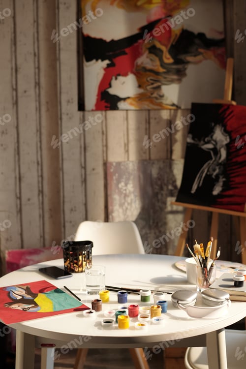 Preview: Art Workspace Featuring Painting Supplies and Creative Area