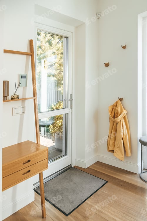 Preview: Front entry foyer of a cozy home with wood tones decor