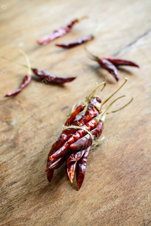 Preview: Dried chilli peppers on rustic wooden