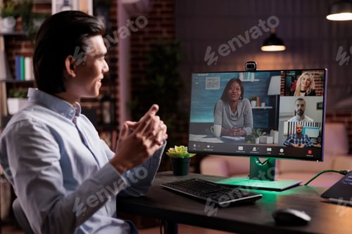 Preview: Male freelancer talking to colleagues on videoconference