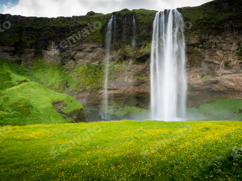 Preview: A waterfall cascade over a sheer cliff.