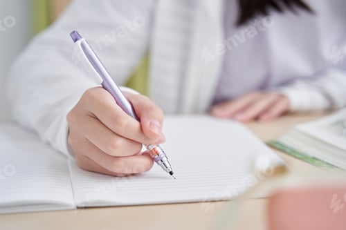 Preview: Japanese girl at hand doing her living room homework