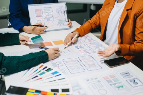 Preview: Close up view of UI developer team brainstorming on their project