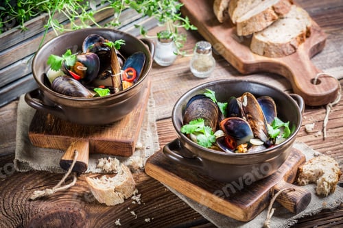 Preview: Tasty mussels in shells with garlic and red peppers