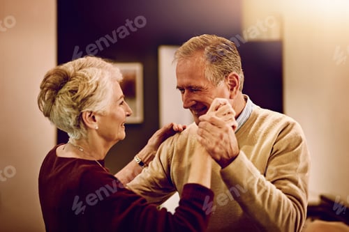 Preview: Shot of an elderly couple dancing with each other in their kitchen