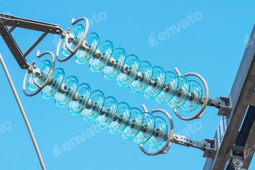 Preview: View of high voltage insulators on a clear blue sky