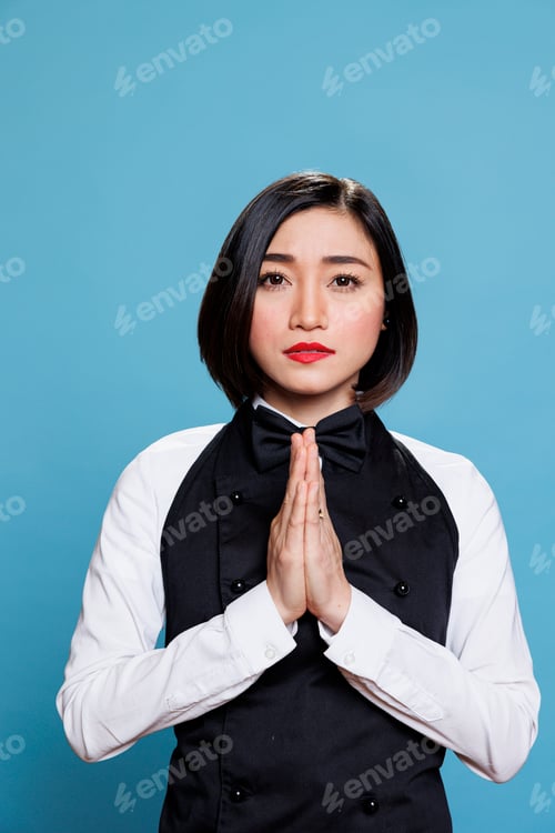 Preview: Waitress meditating with folded palms