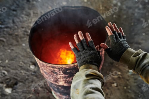 Preview: Tramp warming in cold day outdoors