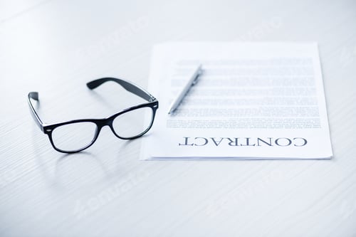 Preview: composition with eyeglasses and business documents on white desk