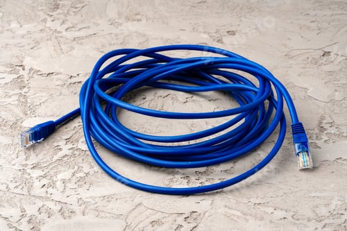Preview: Colored network cable patch-cord on gray textured background