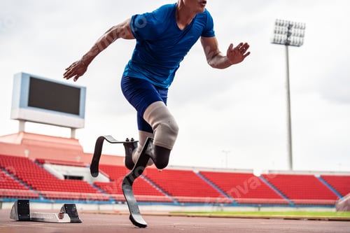 Preview: Close up of para-athletes disabled with prosthetic blades run at stadium.