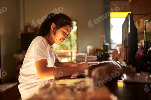 Preview: thai teen girl doing homework and studying at home