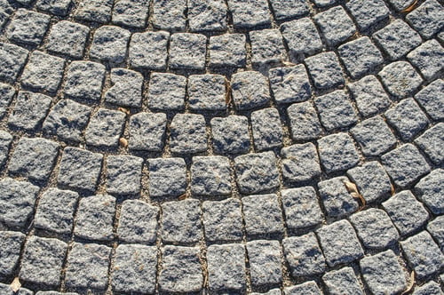 Preview: Overhead shot of old cobblestone pavement in circular pattern