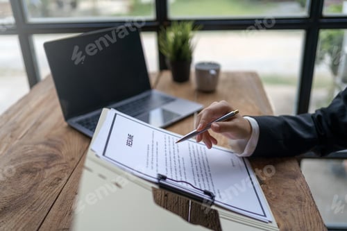 Preview: Close-up of business owner check resume of job applicants in company at the office.