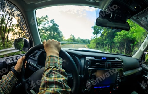 Preview: People driving car on mountain road