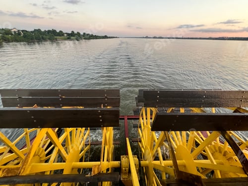 Preview: Riverboat Paddle Wheel Turning at Dusk on River