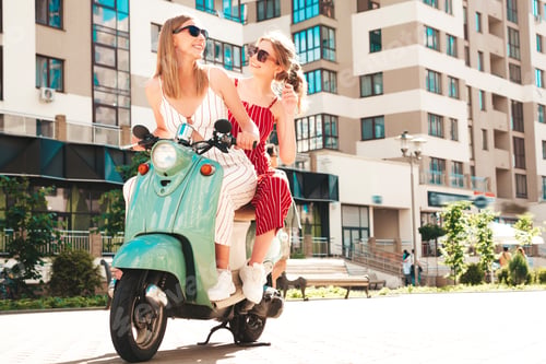 Preview: Two young beautiful woman posing outdoors
