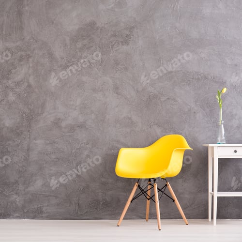 Preview: Yellow chair in grey wall interior