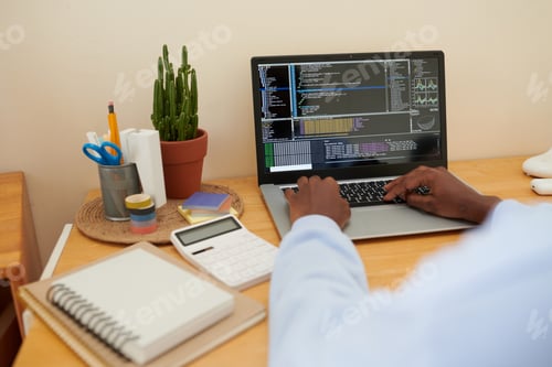 Preview: College Student Coding on Laptop