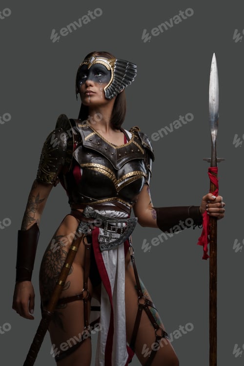Preview: Wild woman warrior holding spear isolated on gray background