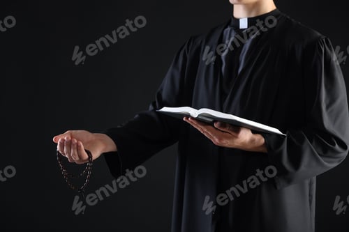 Preview: Priest with Holy Bible and rosary preaching on black background, closeup