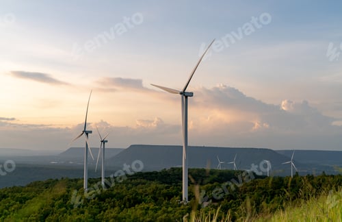 Preview: Scenic Wind Turbines Against Dramatic Sky at Sunset