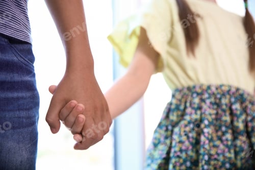 Preview: Children holding hands on blurred background, closeup. Unity concept
