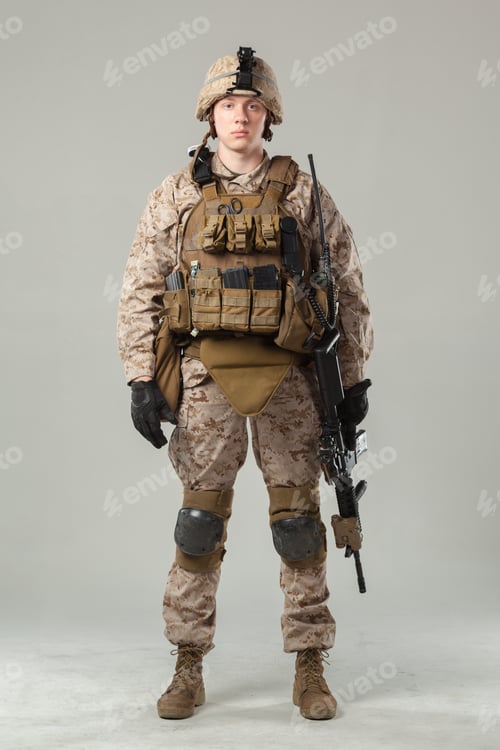 Preview: Soldier stands in combat gear with rifle ready for duty in a studio setting
