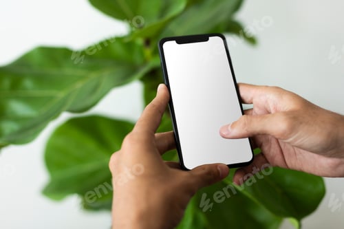 Preview: Man using smartphone with blank screen