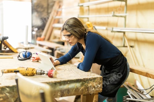 Preview: Carpenter using a tablet for work