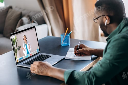 Preview: Man Consulting Doctor Online in Relaxed Setting