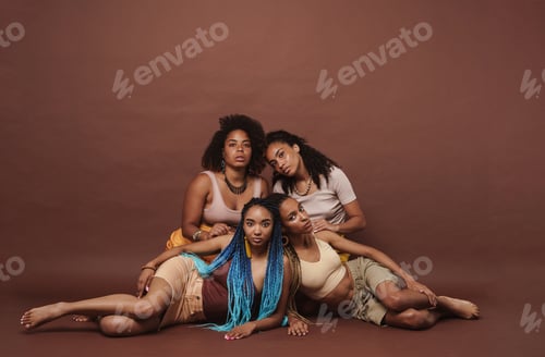 Preview: Young black four women posing together on camera