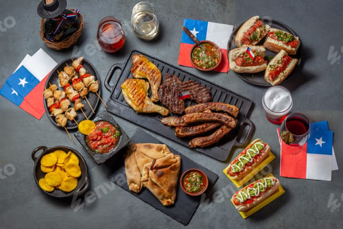 Preview: Chilean independence day table with traditional festive food for fiestas patrias. Dish and drink on