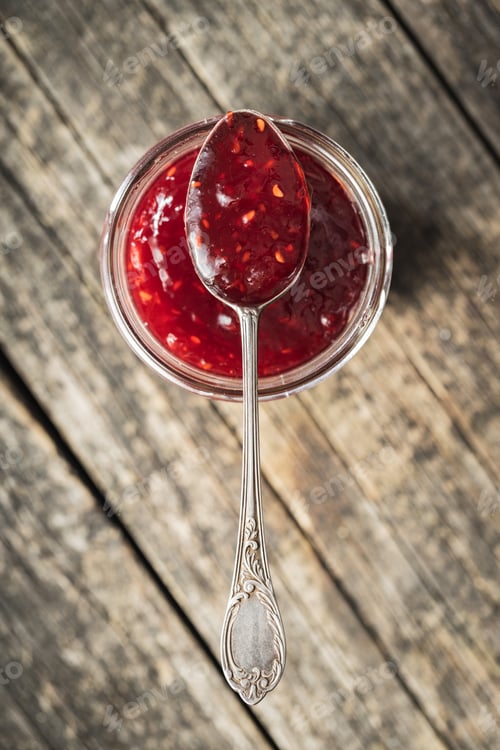 Preview: Red rasberries jam in jar.