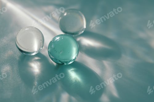 Preview: Glass ball on blurred gray grain texture refraction wall . Light and shadow smoke background.