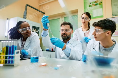 Preview: Biochemist and his team working on a medical research in laboratory.