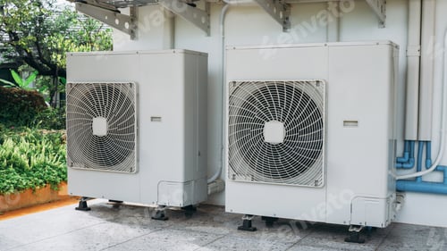 Preview: Two air conditioners are on the side of a building