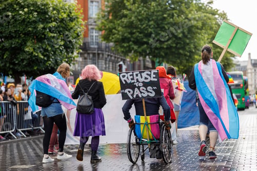 Preview: Diverse people are walking on a gay pride parade on the city streets with flags